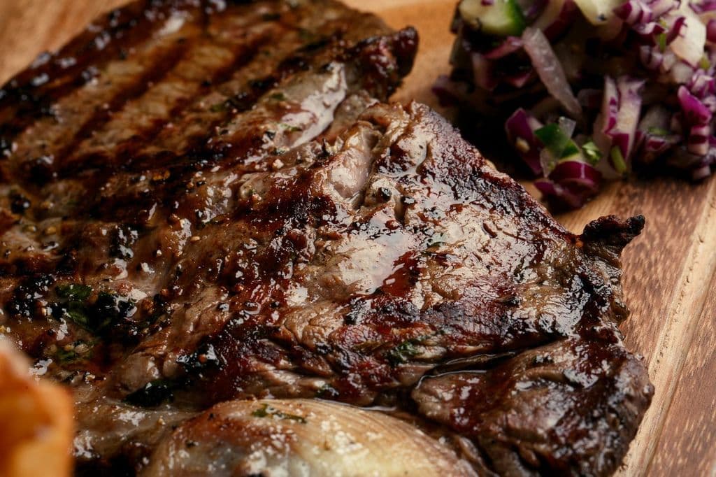 Steak served sizzling on a hot stone